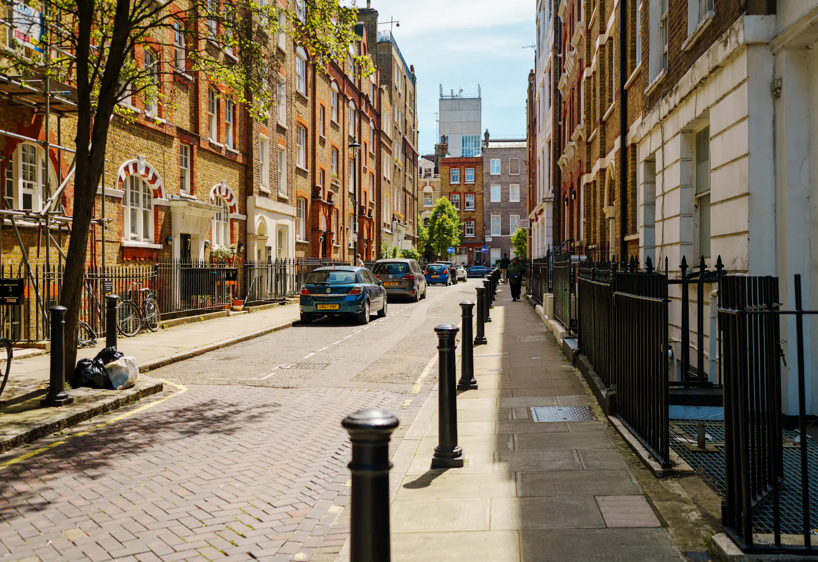 A quiet London street of brick and stone office buildings near the Inns of Court