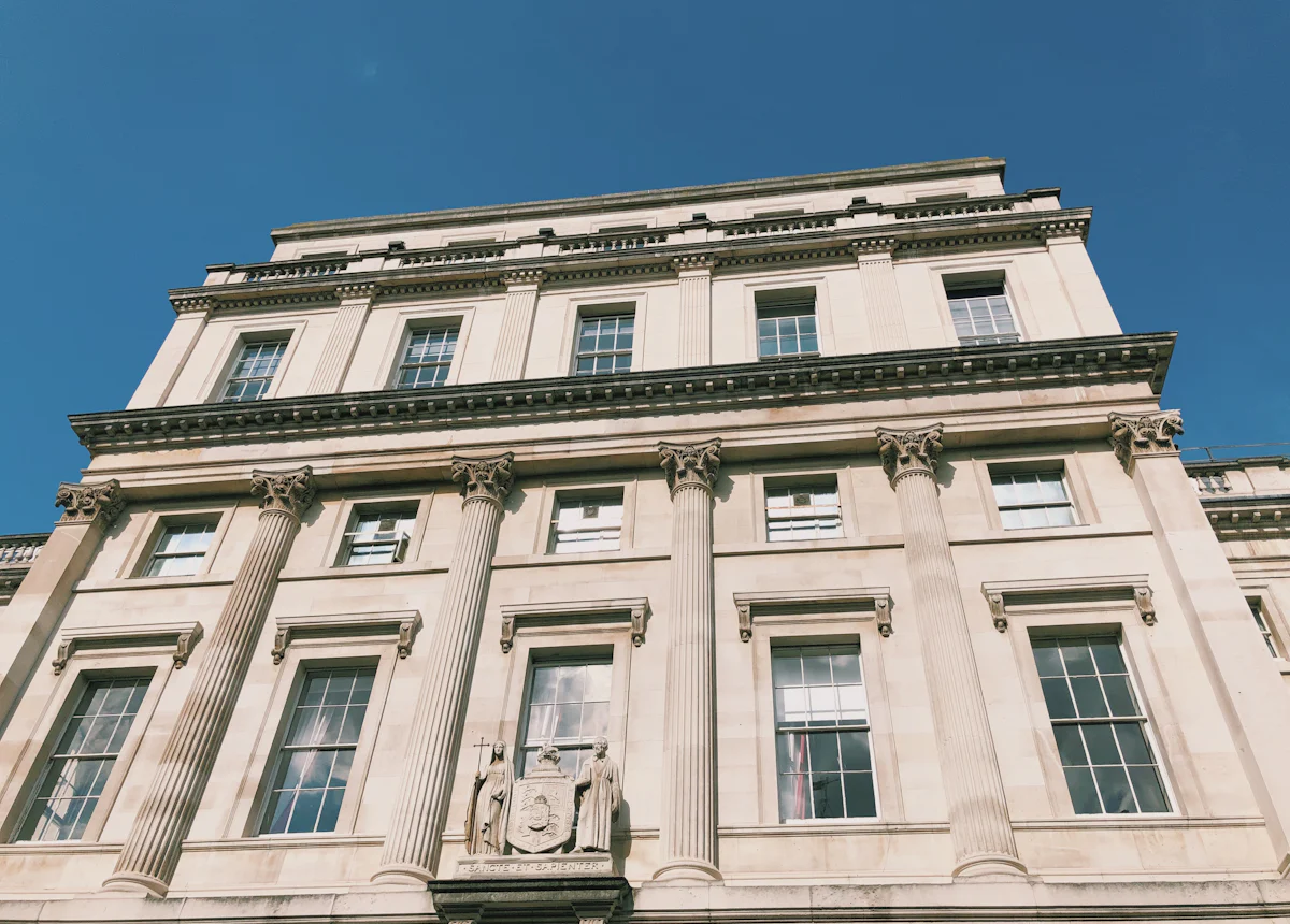 Classical stone office building with tall sash windows
